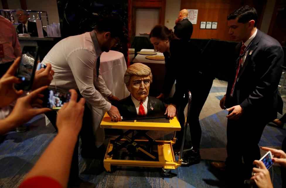 A cake in the form of Republican U.S. presidential nominee Donald Trump is brought into the hotel where his election night rally will be held